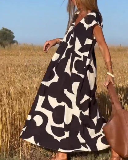 Vestido estampado con escote en V y corte fluido – STEPHARA