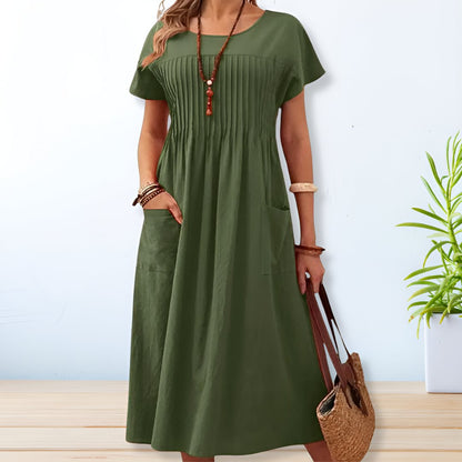 Vestido midi con corte relajado, detalle plisado y bolsillos – SERENA