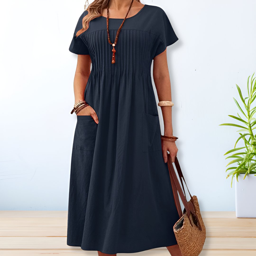 Vestido midi con corte relajado, detalle plisado y bolsillos – SERENA