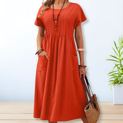 Vestido midi con corte relajado, detalle plisado y bolsillos – SERENA
