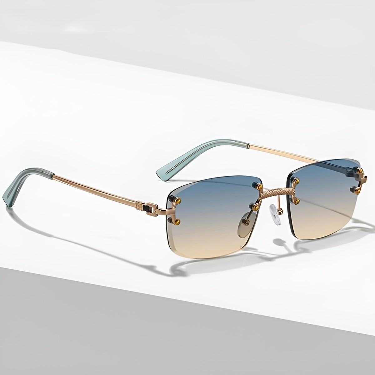 MAXIMO – Gafas de sol sin montura con varillas metálicas doradas y lentes degradados con protección UV400