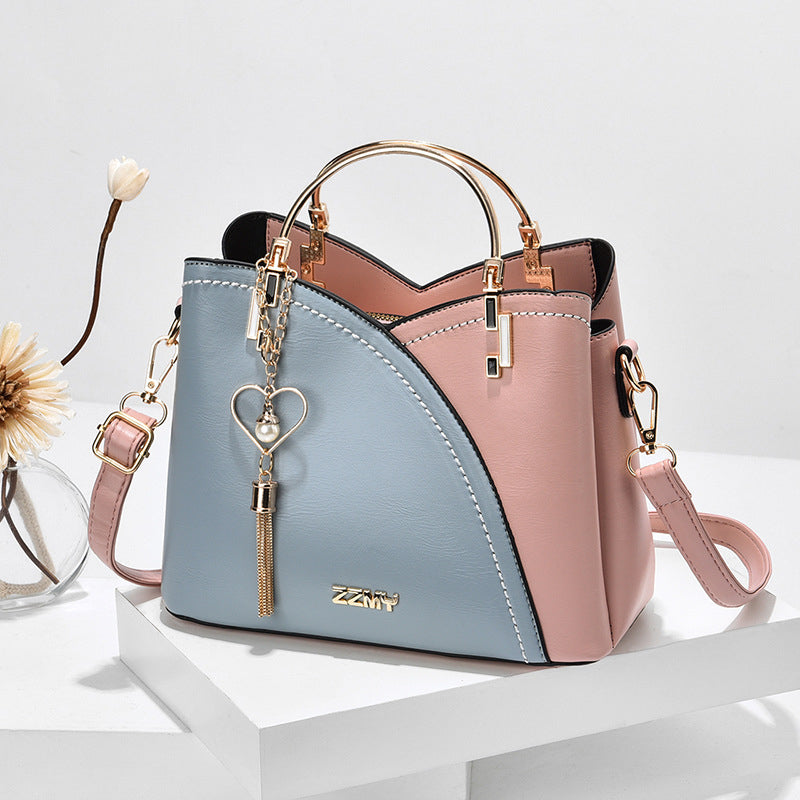 Bolso de mano lujoso con acabado elegante y correa ajustable – LOREVIA